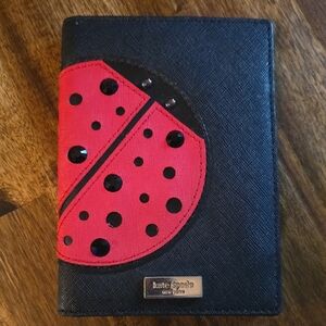 Kate Spade Black and Red Ladybug Passport cover